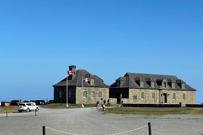 Fortress of Louisbourg Tour: Explore 18th Century History - Fortress of Louisbourg: cobblestones, barracks, and actors in 18th-century mode